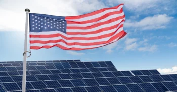 American flag over solar panels