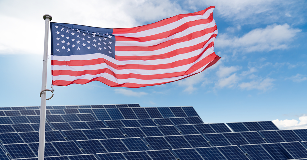 American flag over solar panels